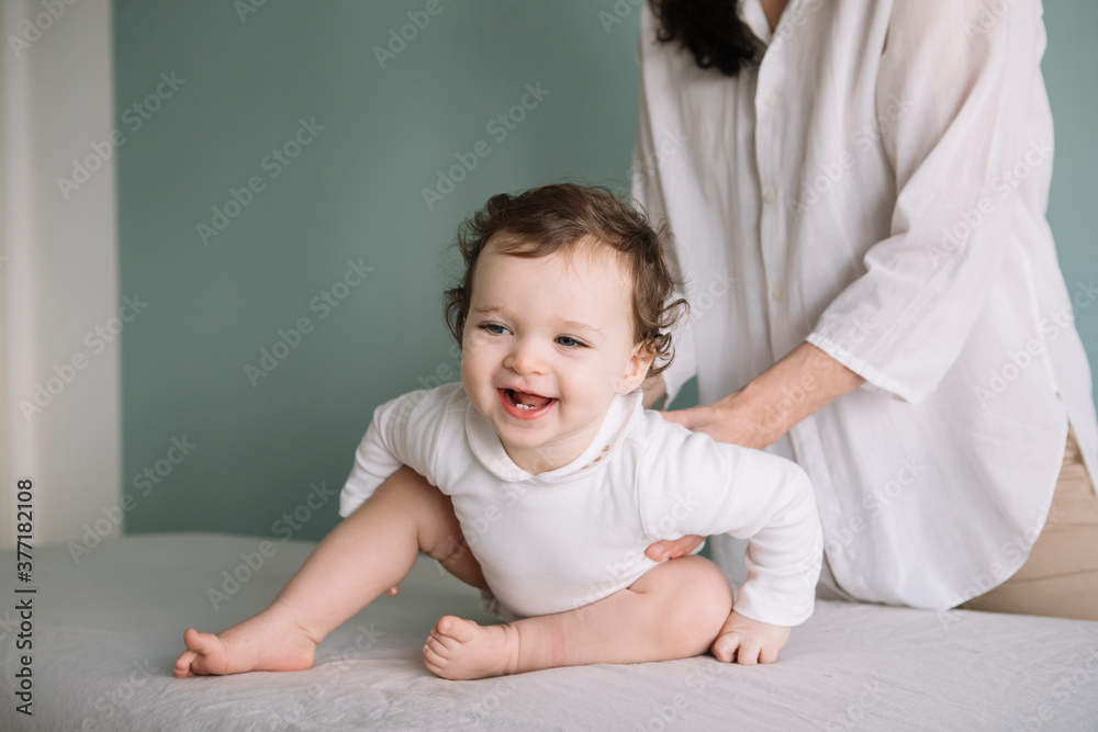 Professional Osteopath Working With Crawling Toddler Child Professional Osteopath Working With Crawling Toddler Child