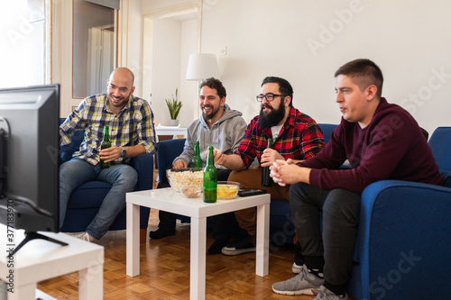 Group of friends watching a match photo