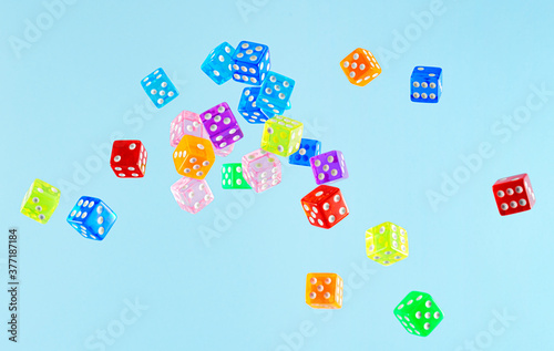 Dice in Air Against Blue Background photo