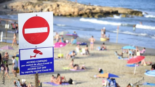 Controls of the capacity of the beaches to avoid spreading coronavirus among the population in Barcelona Spain. photo