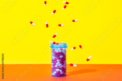 Bottle of Medicine with Capsules photo