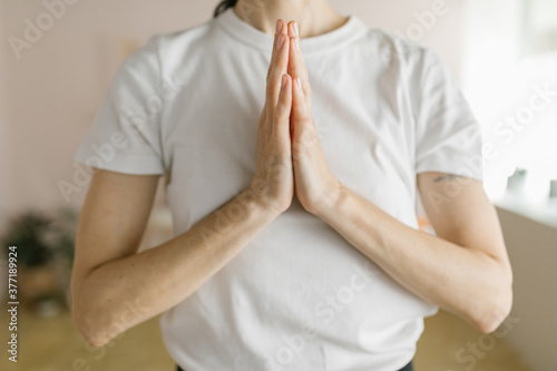 Adult woman practice yoga in a yoga studio photo