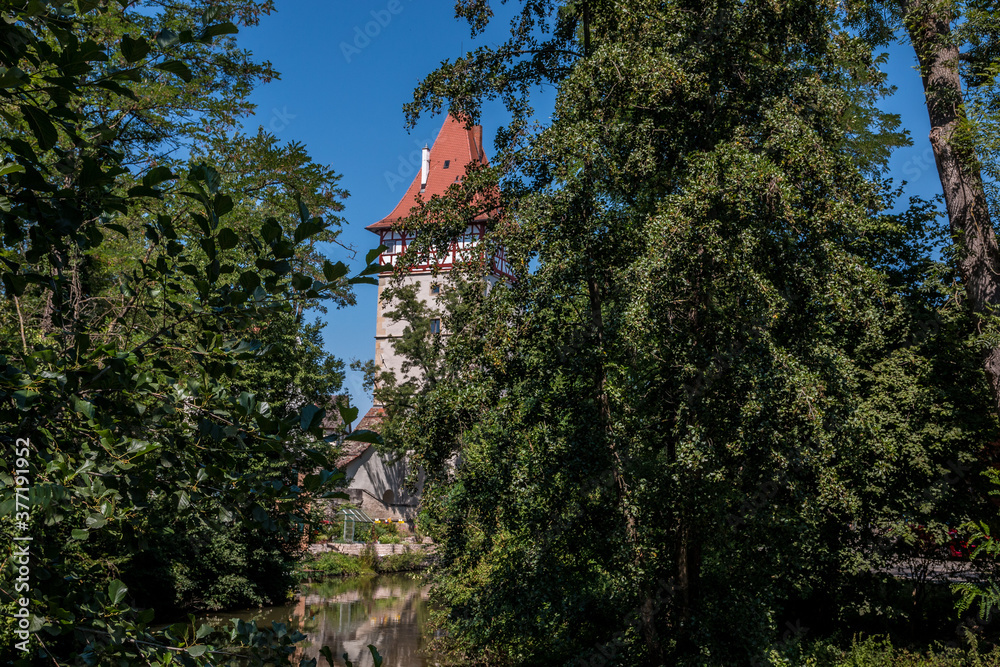 Little church tower near the dirty brown river Little church tower near the dirty brown river