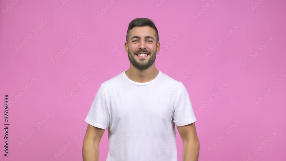 Young caucasian handsome man inviting to come, confident and smiling, open arms to receive someone, friendly Young caucasian handsome man inviting to come, confident and smiling, open arms to receive someone, friendly
