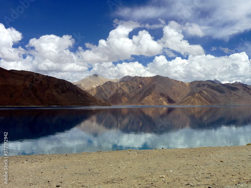 Mountains reflections into transparent water of the Pangong lake, Changthang region, Ladakh, India