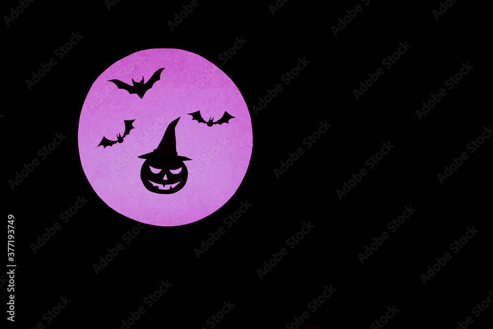 Dark Halloween background.Silhouette of a pumpkin in a hat and bats on the background of a round full moon in purple.copy space.creepy mood