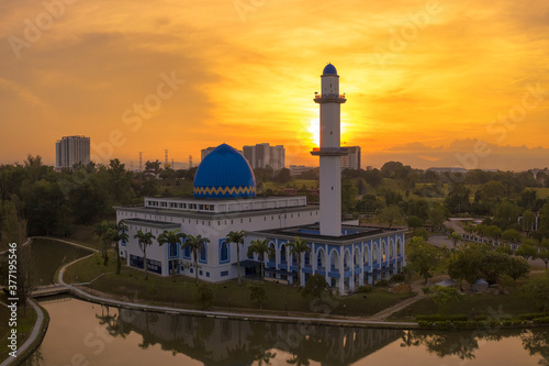 A sunrise scene of local muslim mosque taken via drone during a lockdown from Kuala Lumpur, Malaysia. photo