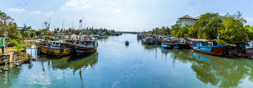 A panorama view of fishing vessels across the entrance to the lagoon in Negombo, Sri Lanka