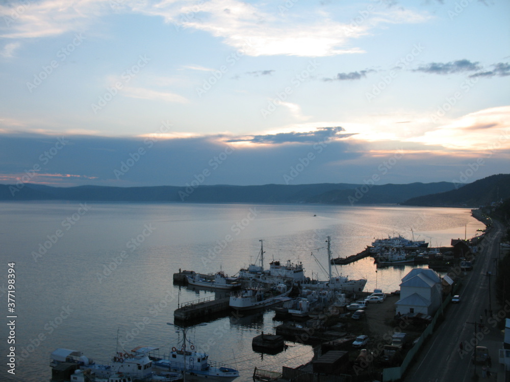 Marina on lake Baikal in the evening, Listvyanka village Marina on lake Baikal in the evening, Listvyanka village