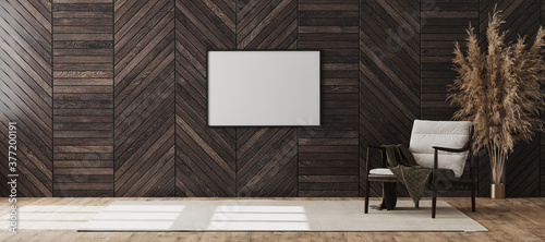 Fototapeta Naklejka Na Ścianę i Meble -  Blank picture frame mock up in empty modern room interior background with wooden decorative panel on the wall and wooden chair with blanket, living room interior background, 3d rendering