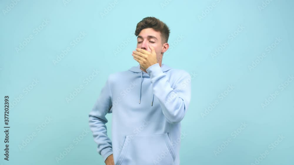 Young caucasian student man tired and very sleepy, looking comfortable and relaxed, sleep gesture Young caucasian student man tired and very sleepy, looking comfortable and relaxed, sleep gesture