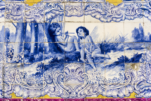 panels of polychrome azulejos on the walls of a beautiful ruined house in Setubal