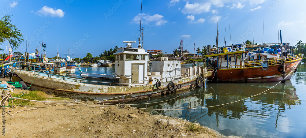 A view of fishing vessels berthed at the entrance to the lagoon in Negombo, Sri Lanka