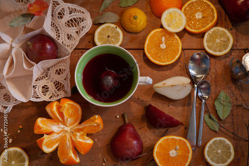 Cirtus and piers in laces with a cup of hibiscus tea photo