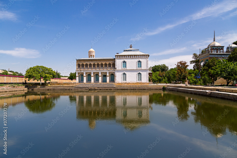 Reflection in the pond of the ancient summer home of Emir, near Bukhara, Uzbekistan