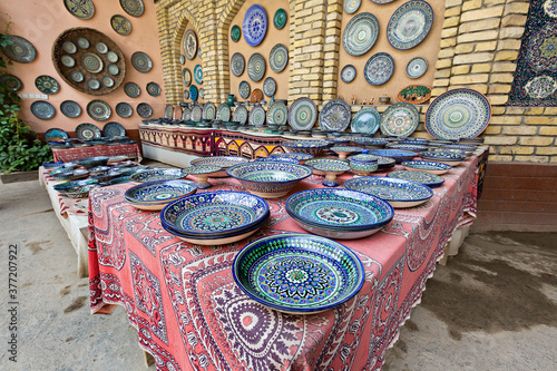 Pottery shop with ceramic plates, in Rishtan, Uzbekistan photo