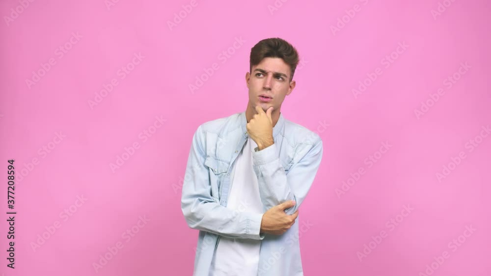 Young student teenager man who feels sad and pensive, looking at copy space Young student teenager man who feels sad and pensive, looking at copy space