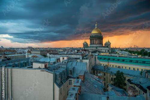 View of St. Isaac's Cathedral, Saint Petersburg city, Russia. Storm clouds on the horizon, beautiful cityscape in a thunder © vladi_mir