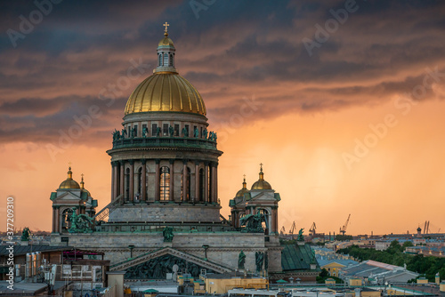 View of St. Isaac's Cathedral, Saint Petersburg city, Russia. Storm clouds on the horizon, beautiful cityscape in a thunder © vladi_mir