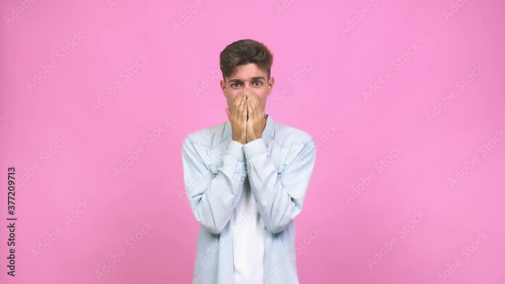 Young student teenager man showing a disappointment gesture with forefinger Young student teenager man showing a disappointment gesture with forefinger