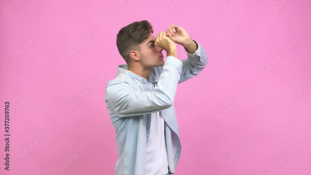 Young student teenager man crossing fingers for having luck Young student teenager man crossing fingers for having luck