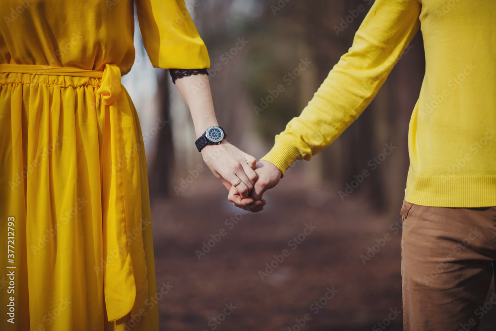 Close-up of people's hands. A man and a woman hold hands
