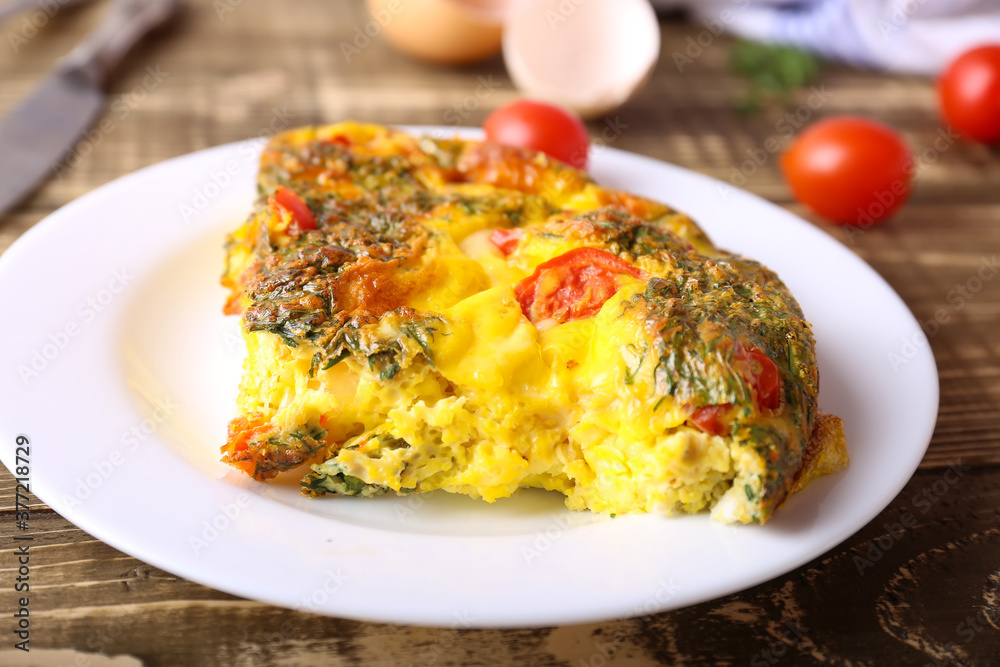 Omelet with vegetables close-up on wooden background Omelet with vegetables close-up on wooden background