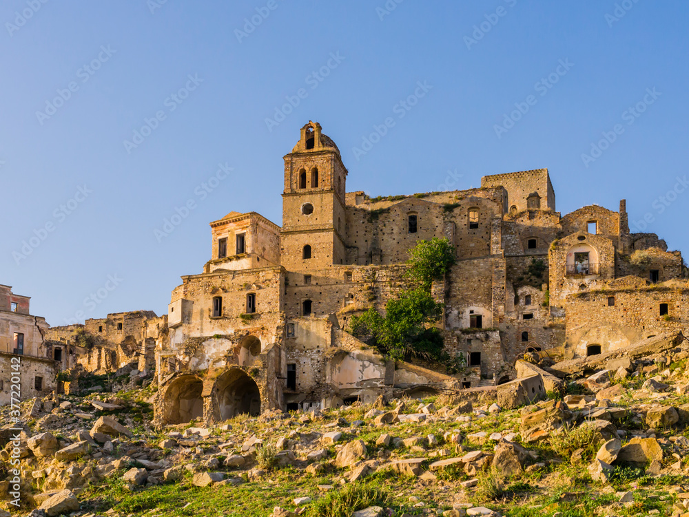 Stunning view of Craco ruins, ghost town abandoned after a landslide, Basilicata region, southern Italy
