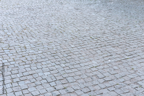 Perspective view of the stone paving stones, background.