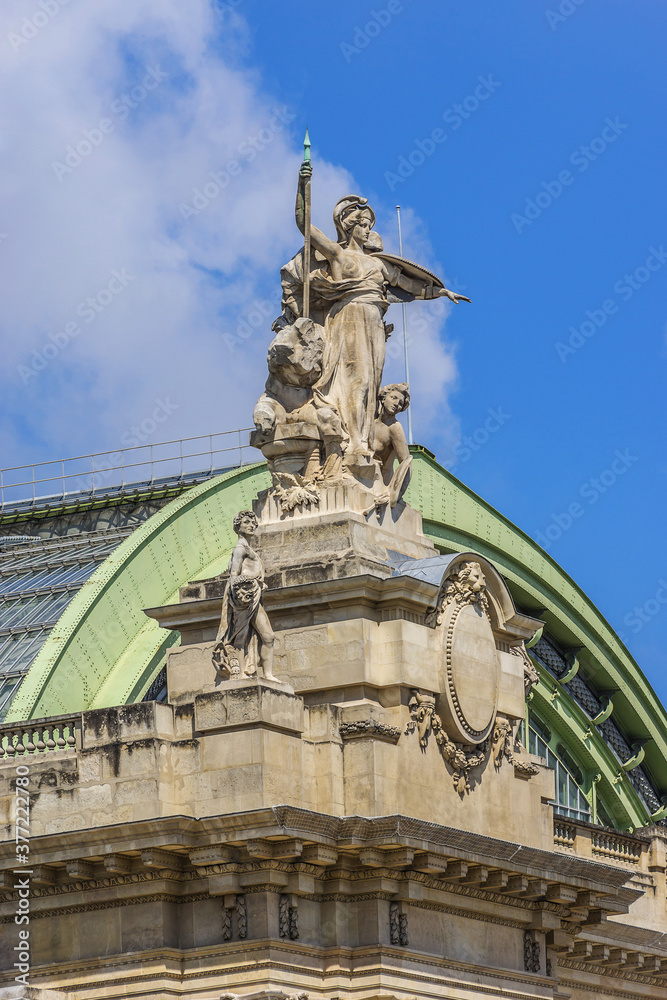 Architectural details of Grand Palais des Champs-Elysees in Paris, France. Grand Palais in Beaux-Arts architecture style built for Universal Exposition of 1900.