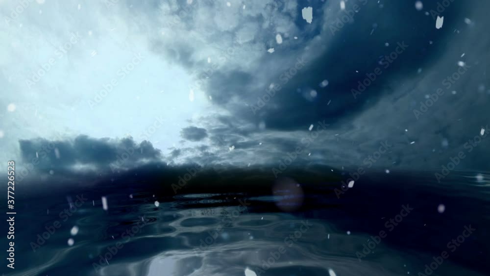 Snowing on Stormy Clouds Over Dark Ocean Snowing on Stormy Clouds Over Dark Ocean