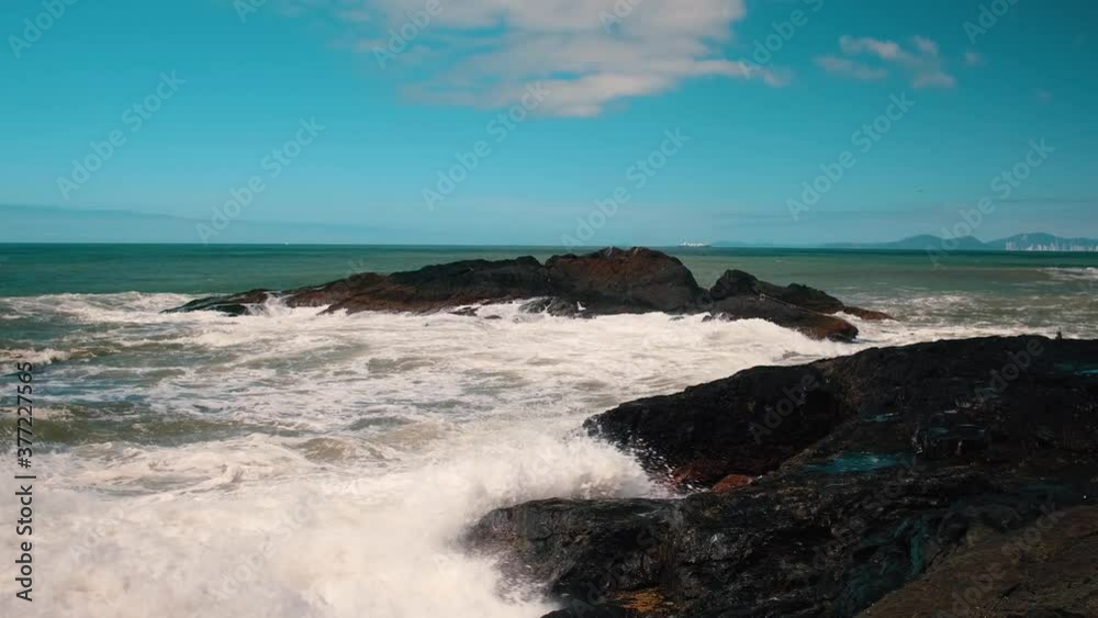 big waves crashing on the beach rock big waves crashing on the beach rock
