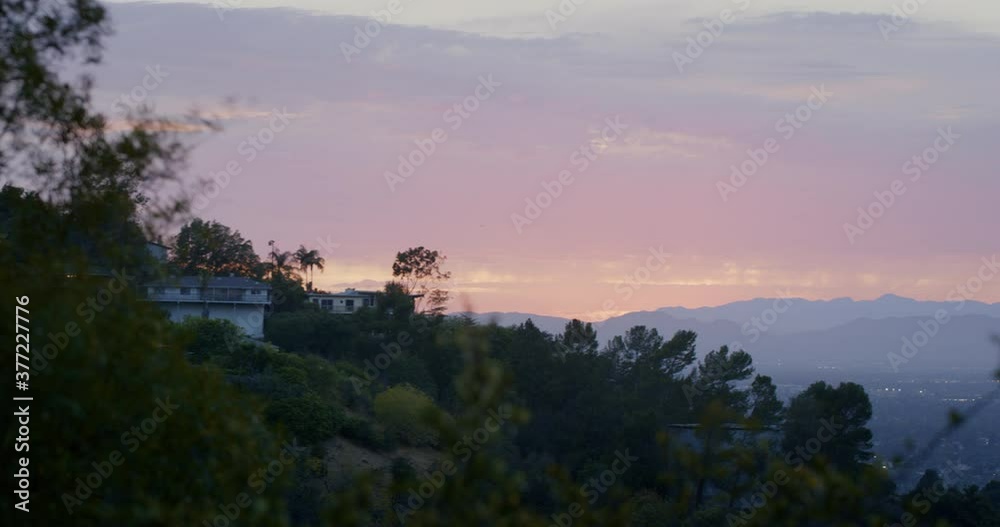 Panning past foliage and mountains at sunset in San Fernando Valley Panning past foliage and mountains at sunset in San Fernando Valley