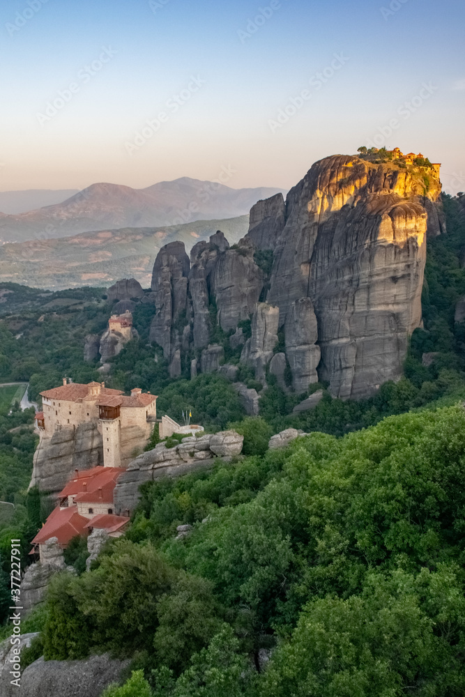 Vertical image of incredible aerial view of the Meteora rocks with Monastery on top