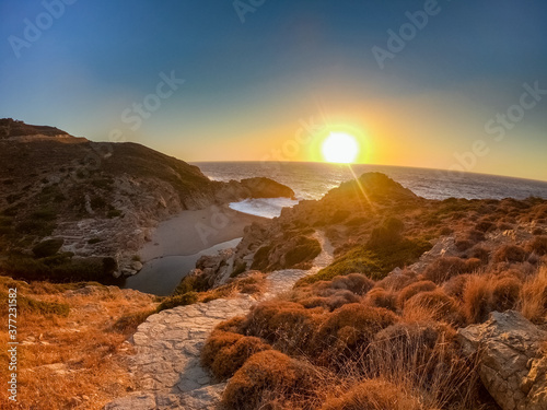 Magical path down to the Nas beach in Ikaria while sunset with red color