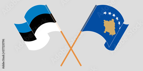 Crossed and waving flags of Kosovo and Estonia