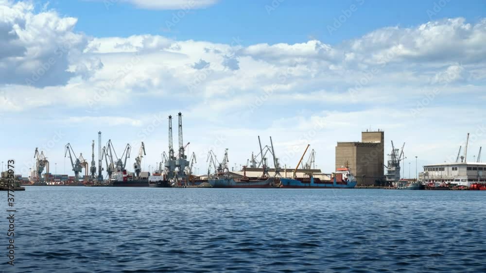 Large cranes in the commercial section of the port of Thessaloniki working in the transport Large cranes in the commercial section of the port of Thessaloniki working in the transport