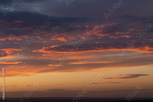 Purple-magenta clouds. Tragic gloomy sky. Landscape with bloody sunset. Fantastic skies on the planet earth. Twilight, nightfall. Blackout.