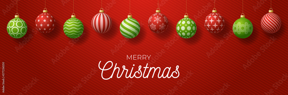 Luxury Merry Christmas horizontal banner. Christmas card with ornate red and green realistic balls hang on a thread on red gradient modern background. Vector illustration. Place for your text