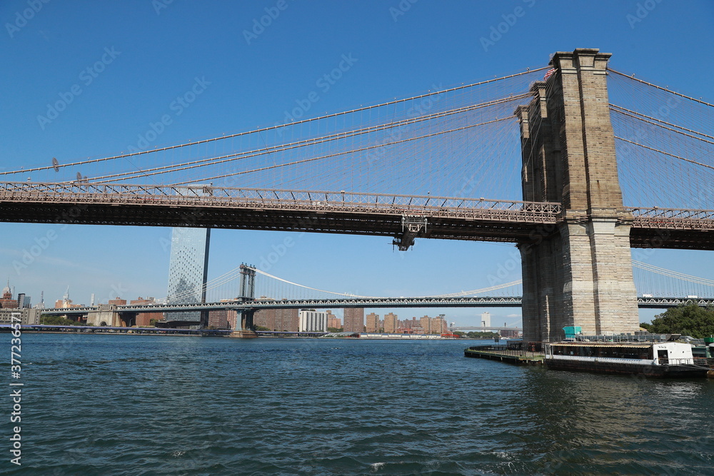 A view of the Brooklyn Bridge from the East River in New York City.