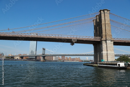 A view of the Brooklyn Bridge from the East River in New York City. © GORDON