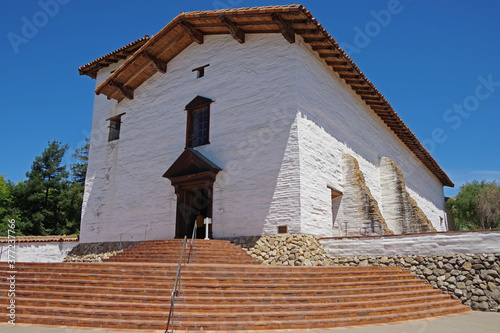 Historic old Spanish San Jose mission in Fremont under blue California summer sky photo