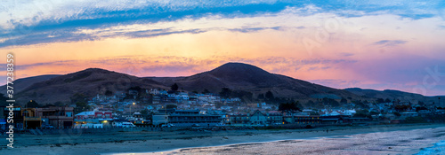 Panoramic sunrise over beach town  ocean