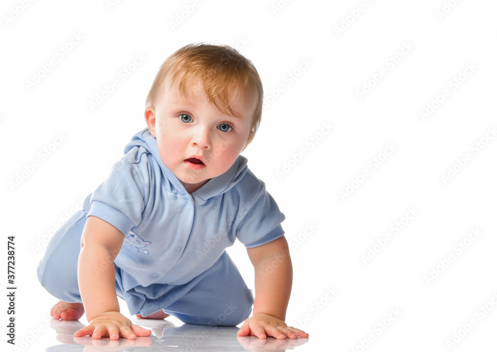 Portrait of a focused child crawling on all fours in the studio on a white background. Portrait of a focused child crawling on all fours in the studio on a white background.