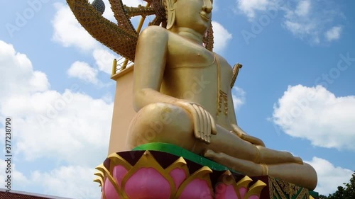 KO SAMUI, THAILAND - FEBRUARY 26, 2020: Stairs to the Statue of big Golden Buddha, Wat Phra Yai temple on koh Samui, Thailand. photo