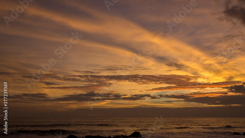 Fototapeta Naklejka Na Ścianę i Meble -  Red sunset over sea with beautiful clouds