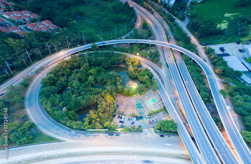 Aerial view of higway road and movement vehicle in Chiang Mai city of Thailand at twilight. photo