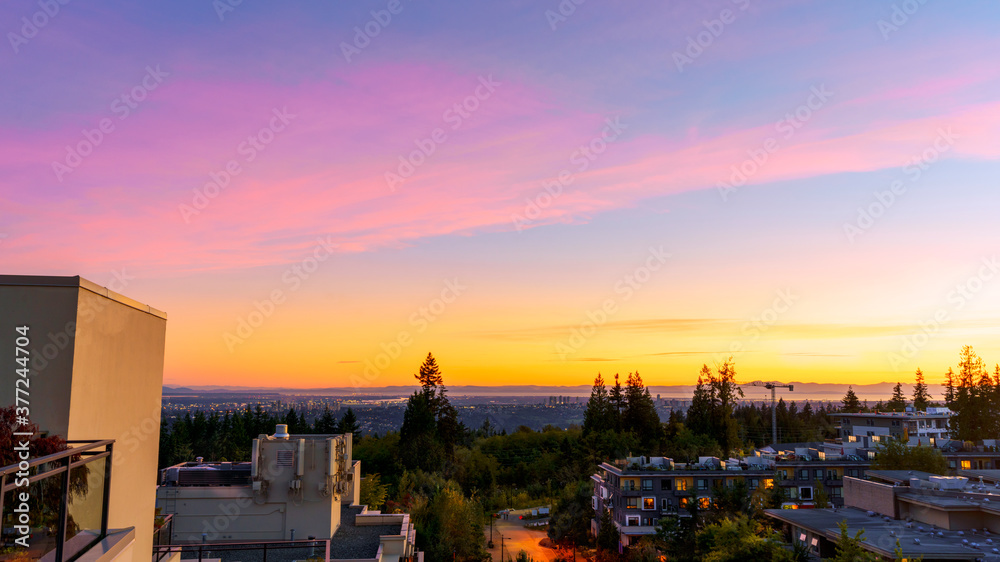 Naklejka premium Dramatic sunset viewed from UniverCity Highlands on Burnaby Mountain - BC summer