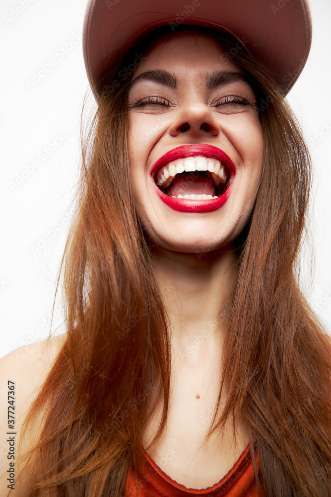 Portrait of a woman in a cap Joy emotion smile fun attractive look Portrait of a woman in a cap Joy emotion smile fun attractive look