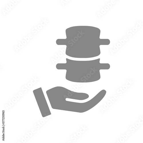 Human spine on hand grey icon. Disease prevention symbol